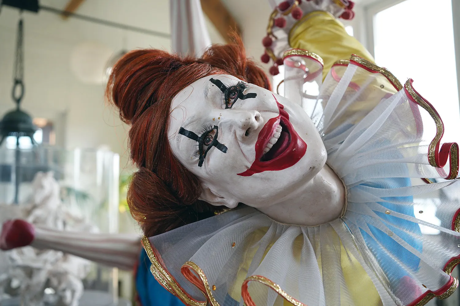 A 20thC Lifesize Painted Plaster & Silk Theatre Prop Model of an Acrobatic Clown by Mark Thompson