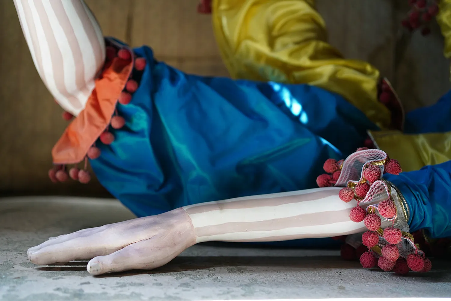 A 20thC Lifesize Painted Plaster & Silk Theatre Prop Model of an Acrobatic Clown by Mark Thompson