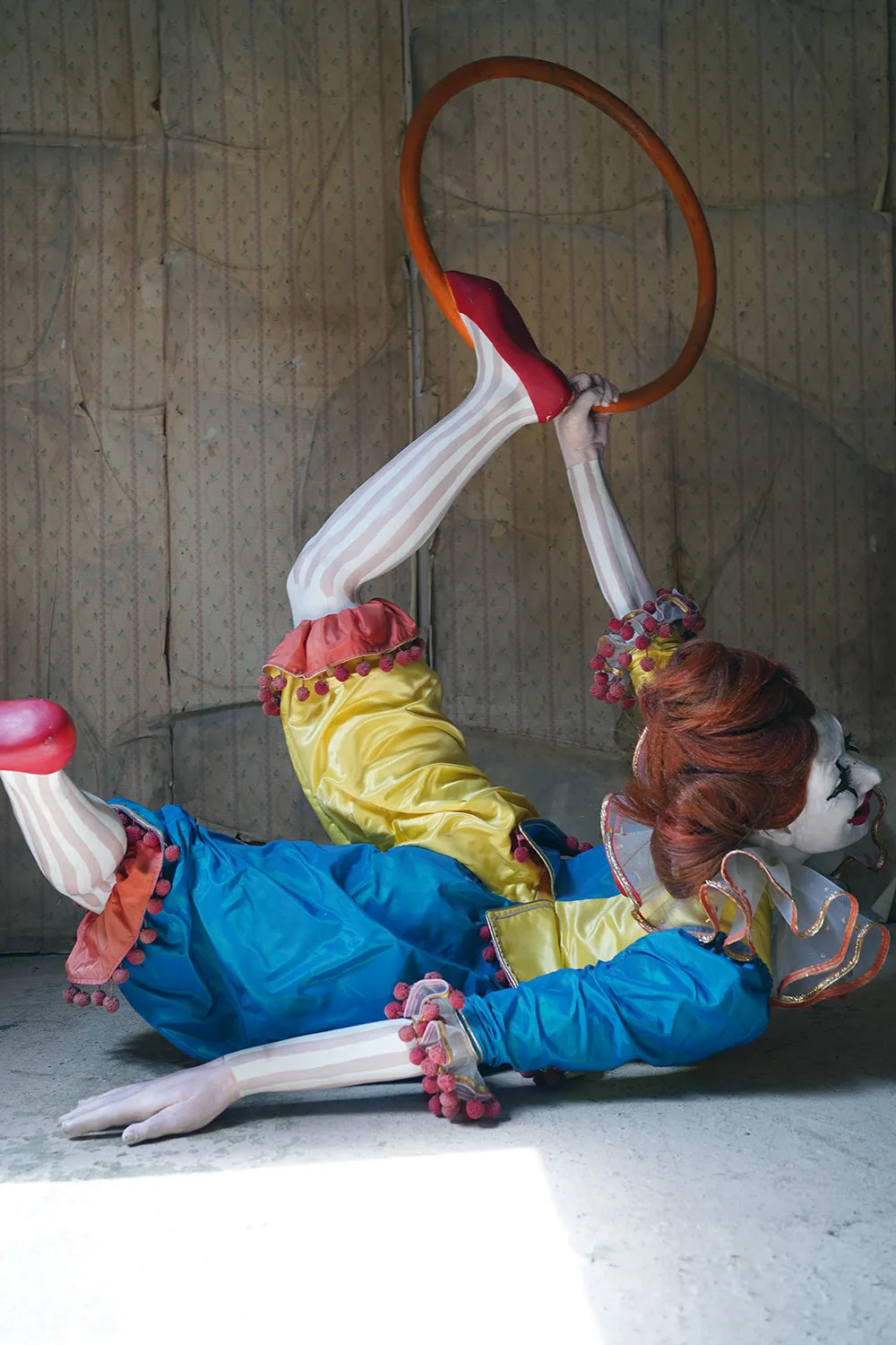 A 20thC Lifesize Painted Plaster & Silk Theatre Prop Model of an Acrobatic Clown by Mark Thompson